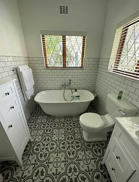 Bathroom with bath, basin and toilet after renovation